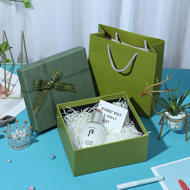 Green lid-and-base gift box with paper filler and matching bag