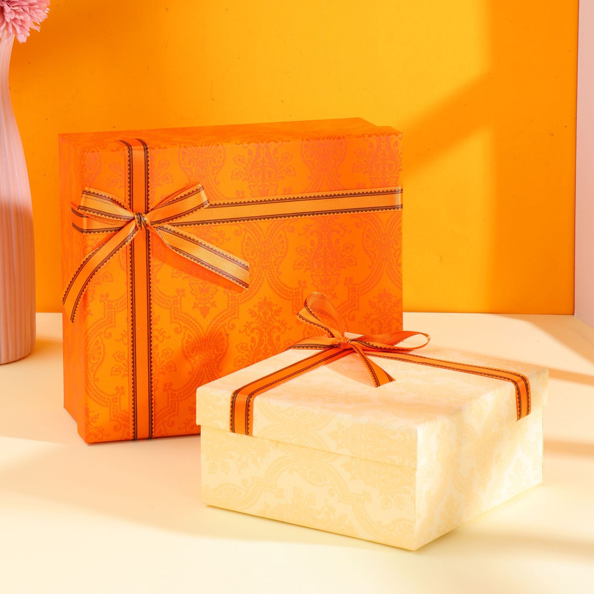 Orange and cream gift boxes tied with ribbons