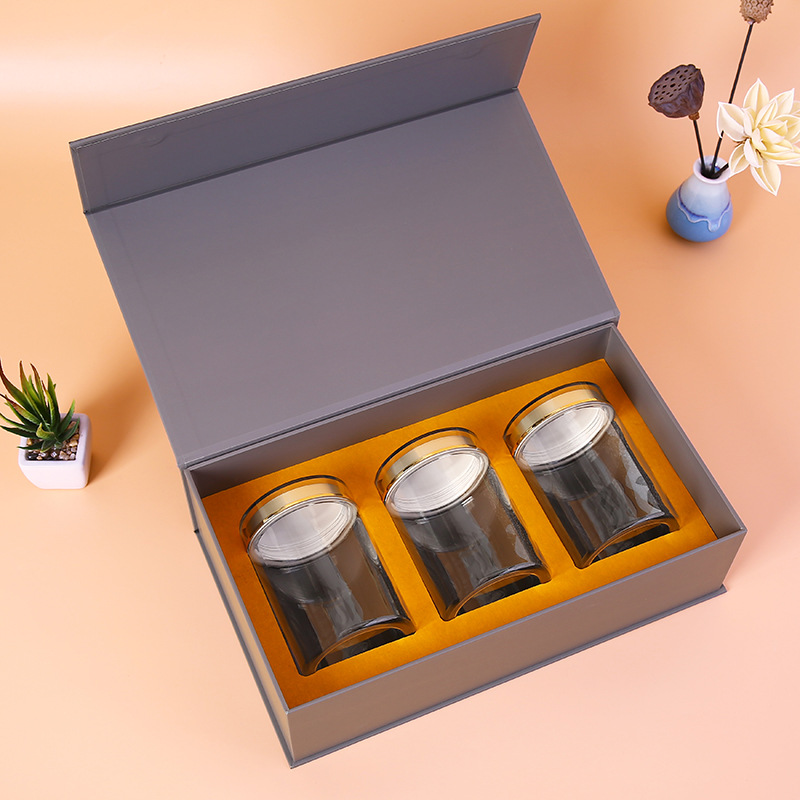 Step-by-step assembly of luxury candle gift box with magnetic closure and satin ribbon