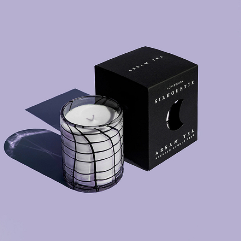 Sleek black candle box featuring modern design and upscale branding