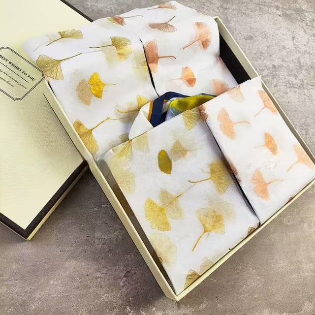 Custom printed tissue paper wrapped around a t-shirt.