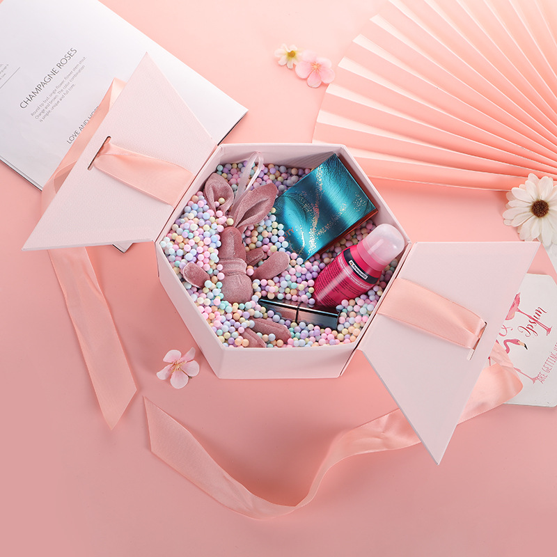 10. Open view of hexagon box with molded pulp insert for candles