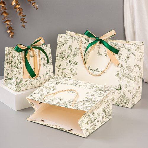 Wholesale paper shopping bags with reinforced handles for durability"