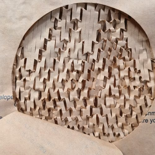 Custom honeycomb paper mailer with kraft exterior and hexagonal padding