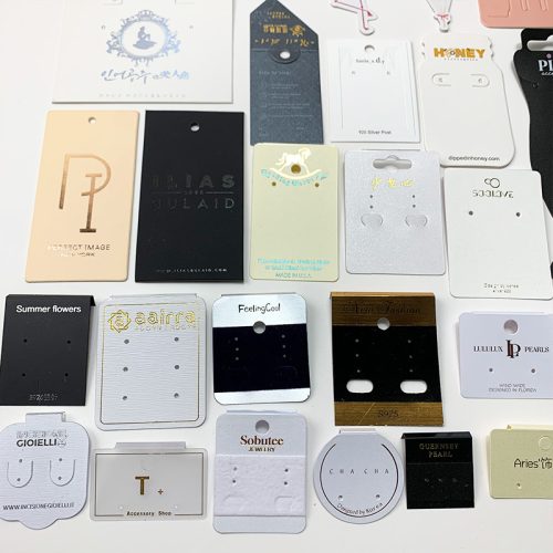Different materials for jewelry cards including premium cardstock, kraft paper, and plastic.
