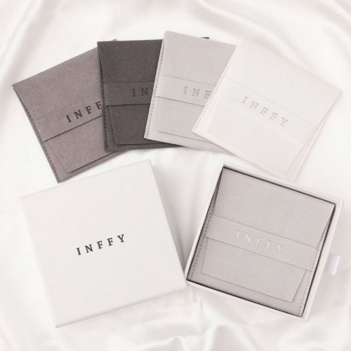 Various sizes of small jewelry bags and pouches, from ring-sized to larger bracelet pouches.