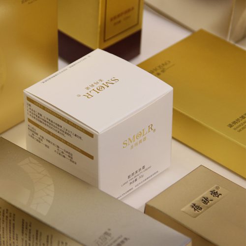 Custom white paperboard box with branded packaging design